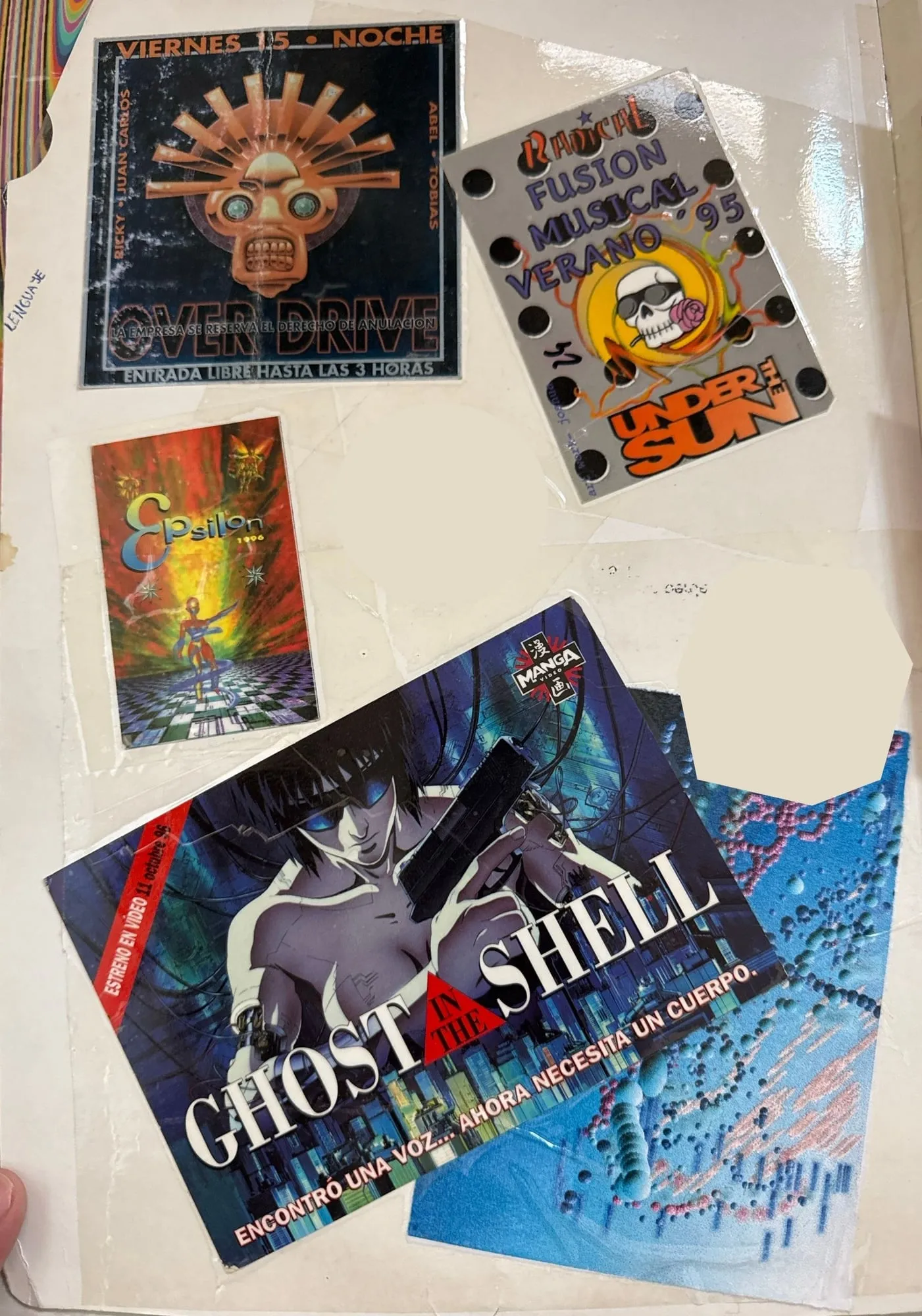 Página interior con una entrada de Over Drive del viernes 15, una de Radical del verano del 95, una tarjeta de Epsilon 1996 y una postal de Ghost in the Shell.